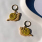 SNAIL huggie in tan & chartreuse
