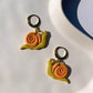 SNAIL huggie in chartreuse & clementine